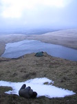 SX12936 Wouko taking a picture of snow by tent.jpg